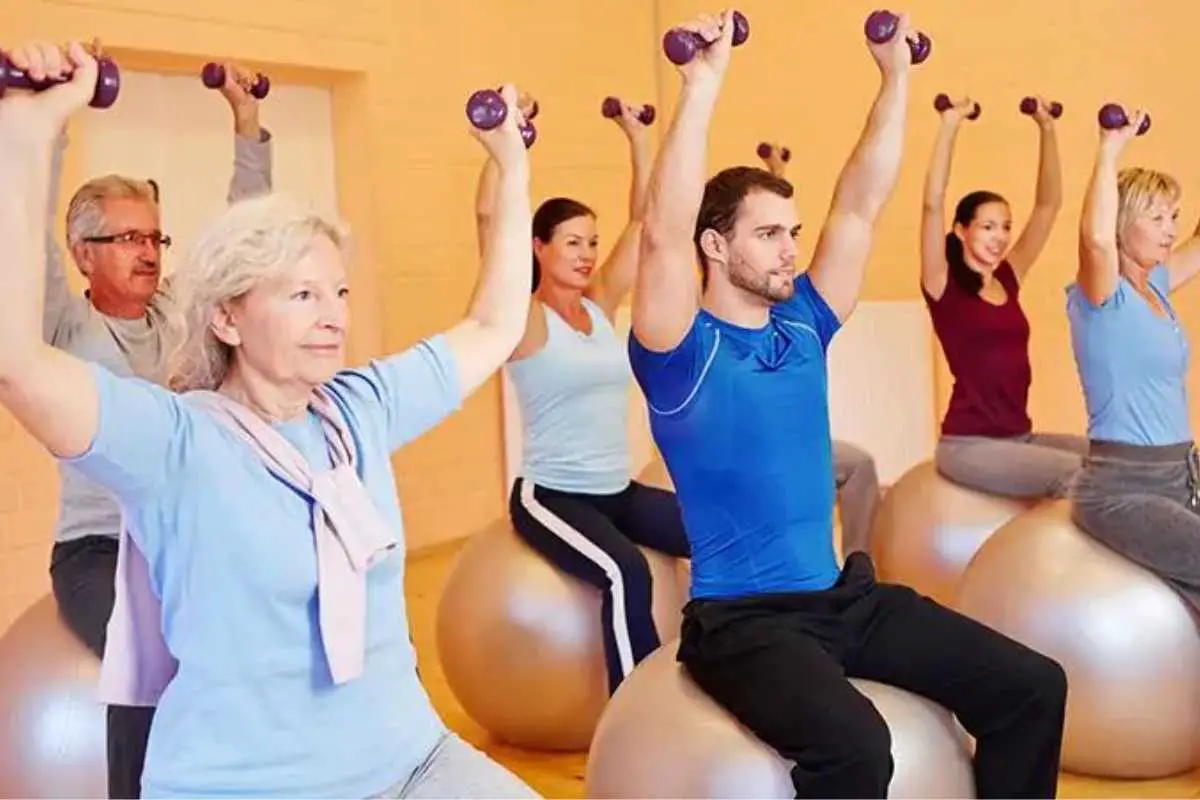 senior citizens working out in a group exercise class which is a perfect gift to give elderly friends or even seniors looking for a fun way to stay in shape