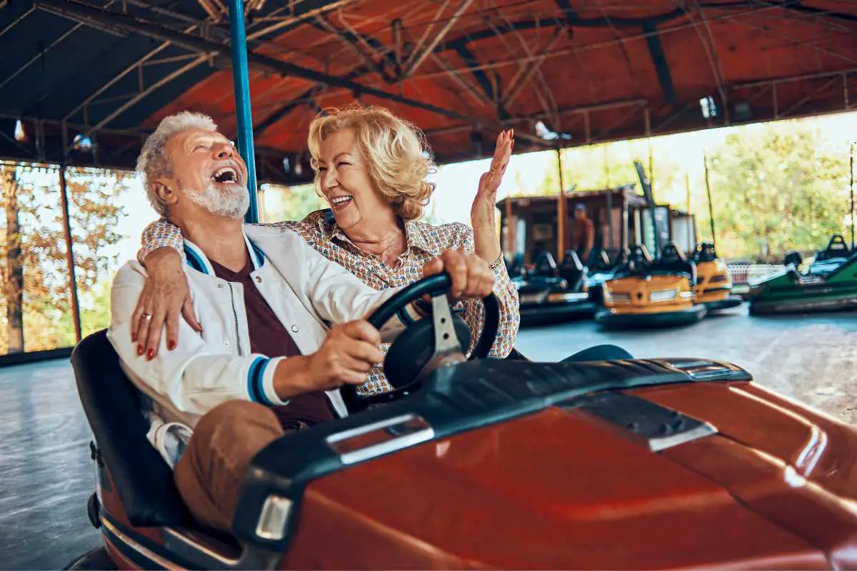 sometimes the best gifts for seniors are fun gifts! photo of two senior citizens enjoying go karting together