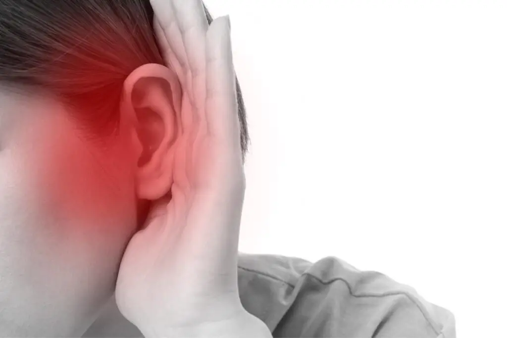 Ear pain conveyed by showing an ear being held by a hand and red color overlaying the cheek and ear