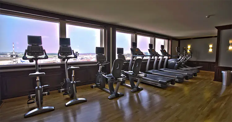 a line of exercise bikes