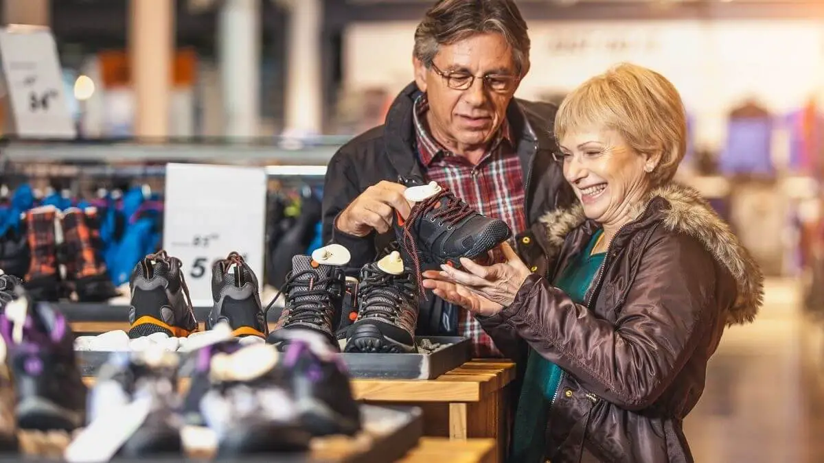 senior couple buying shoes