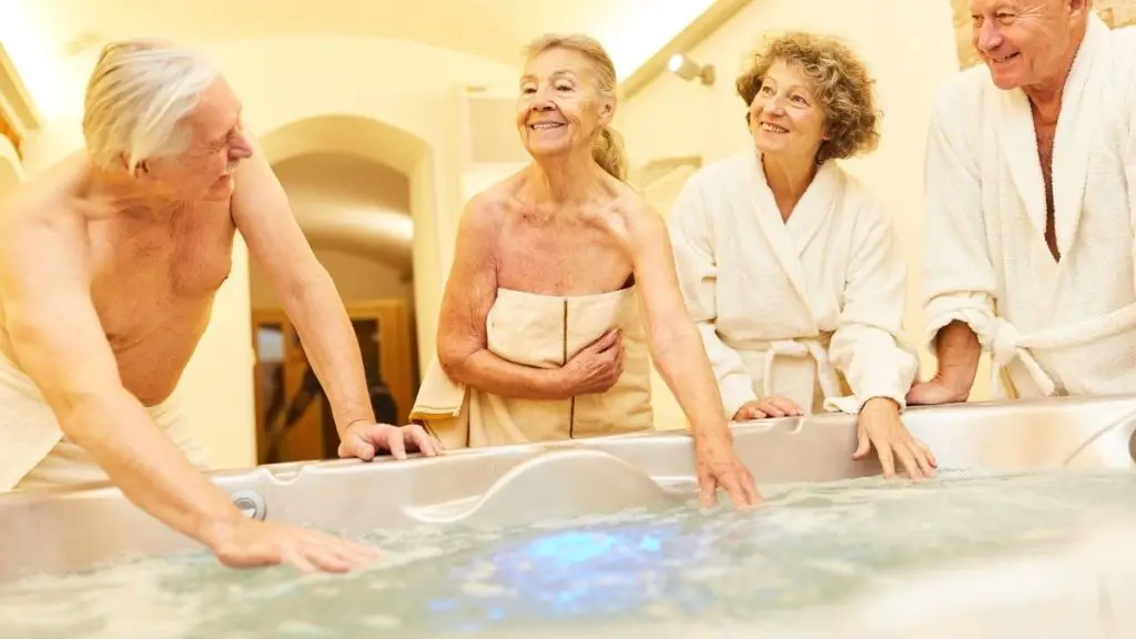 seniors group doing hydrotherapy with portable jets