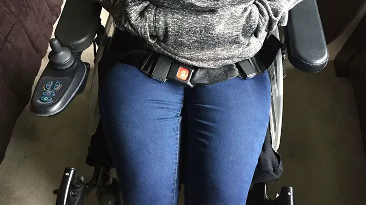 woman wearing wheelchair safety belt