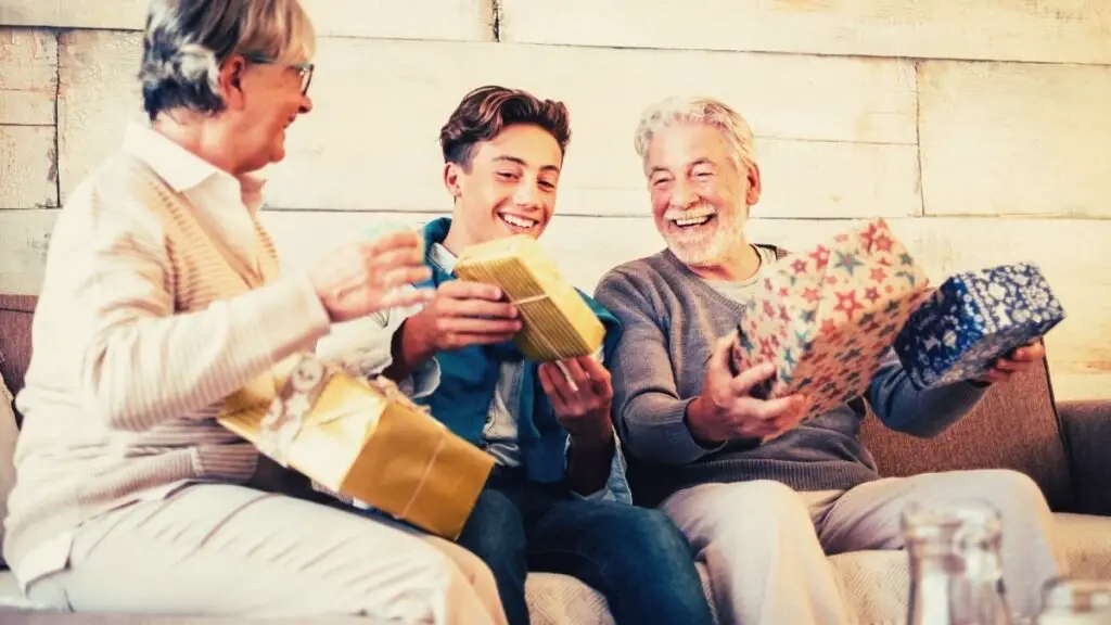 grandparents giving gifts to grandchild