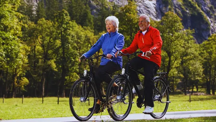 senior couple biking in karwendel, austria