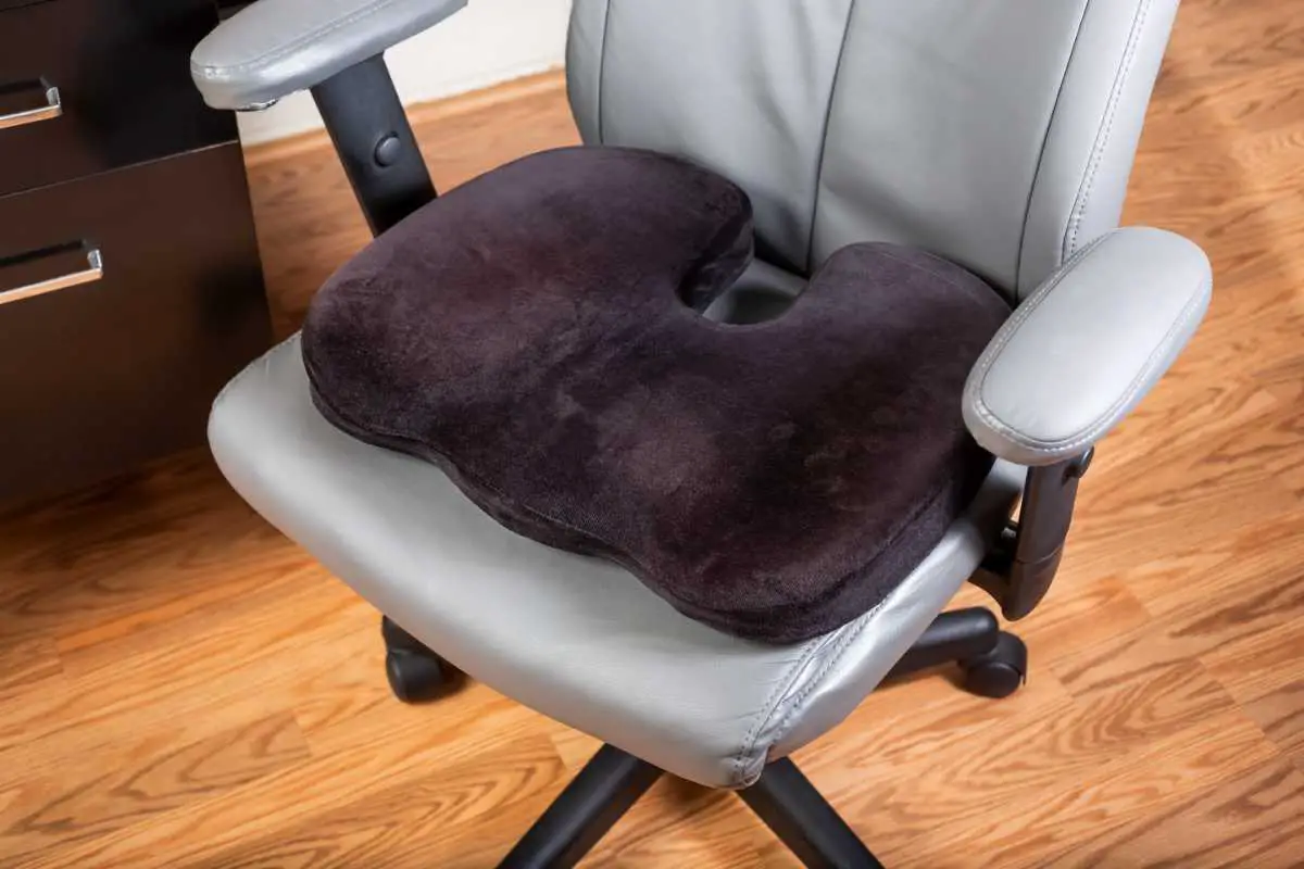 a seat cushion or chair pad on an office chair to increase comfort during long sitting hours