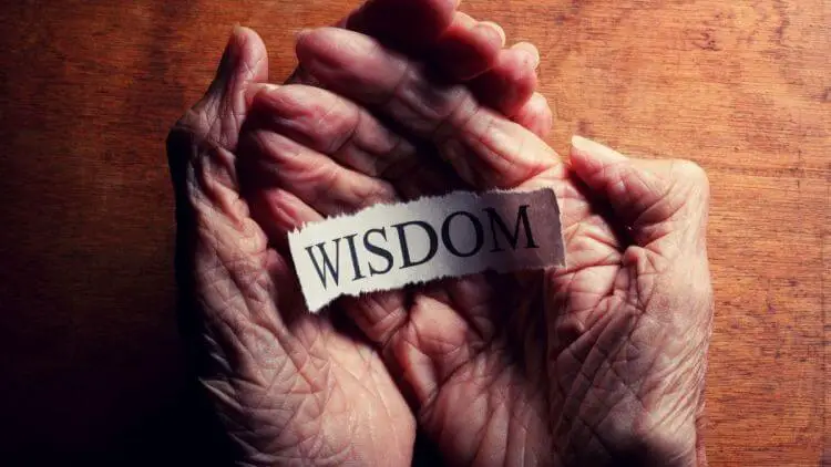 word wisdom on senior hands