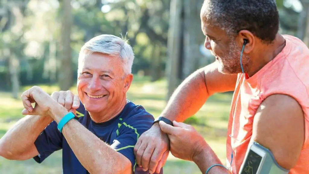 two senior men wearing fitbits for seniors