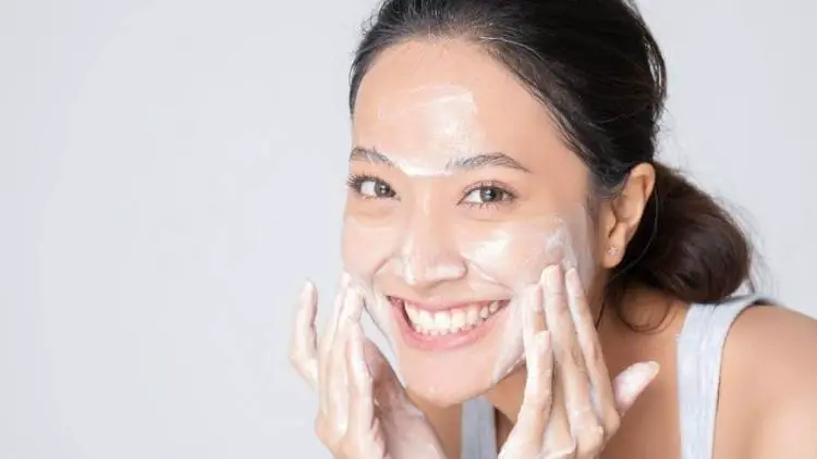 asian female washing face