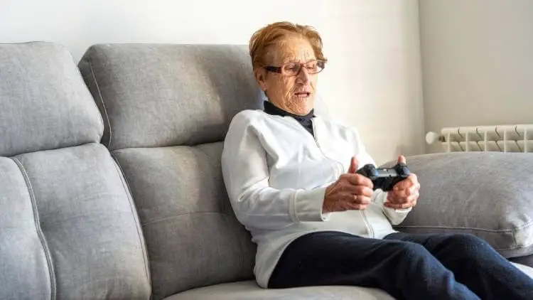senior woman playing video game