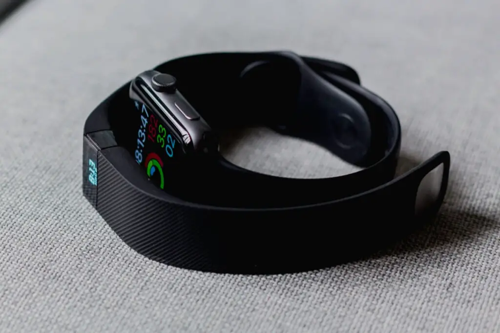 fitbit and apple watch next to each other