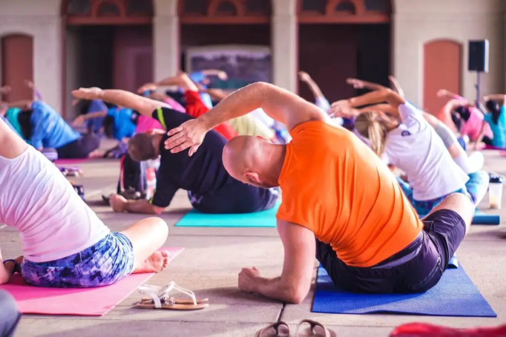 people engaging in a group exercise class