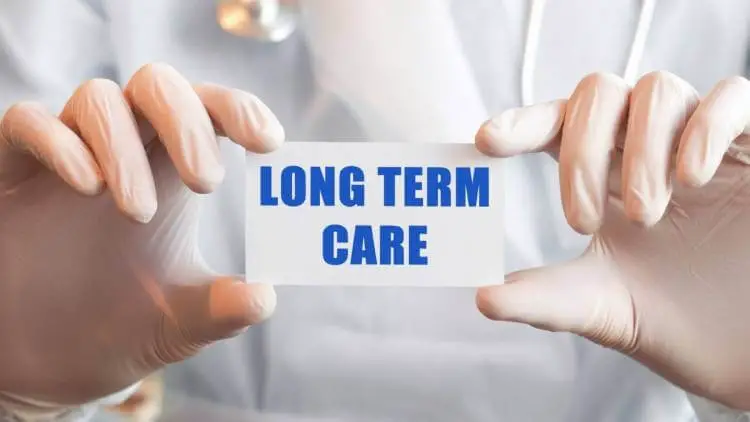 doctor holding long term care card