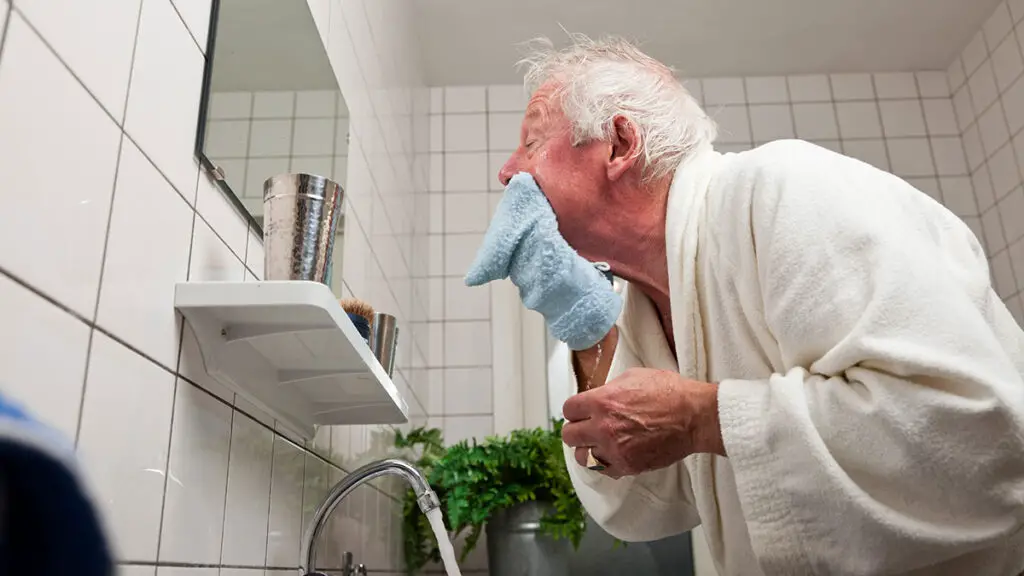 old man using anti-aging skin washes