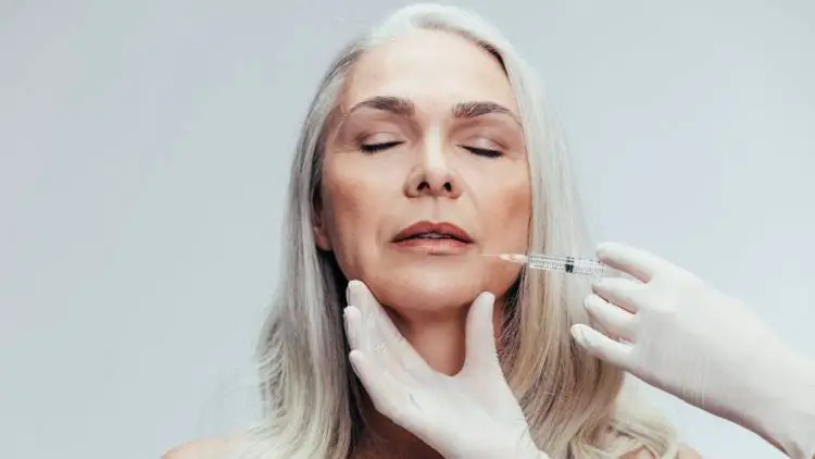 female having botox injection on face
