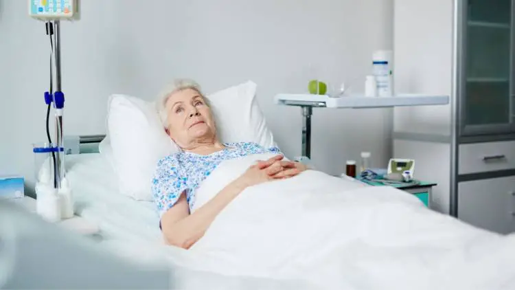 geriatric patient in hospital bed