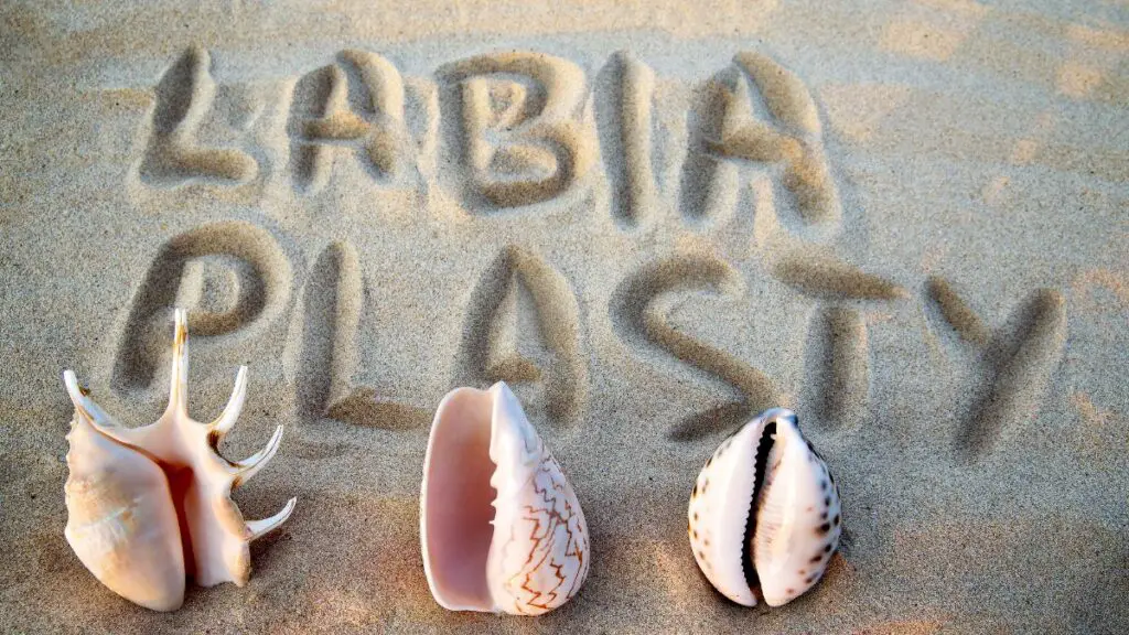 labiaplasty written in sand