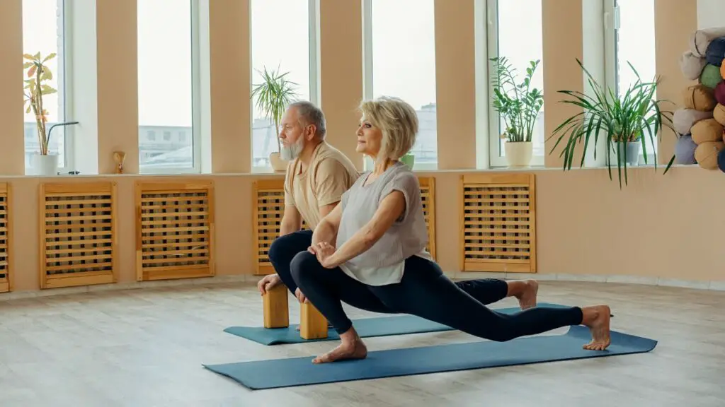 senior couple doing leg stretching