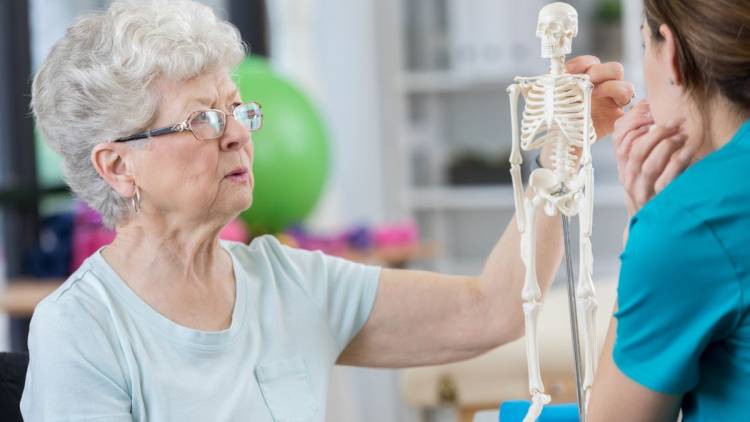 senior woman discusses causes of osteoporosis