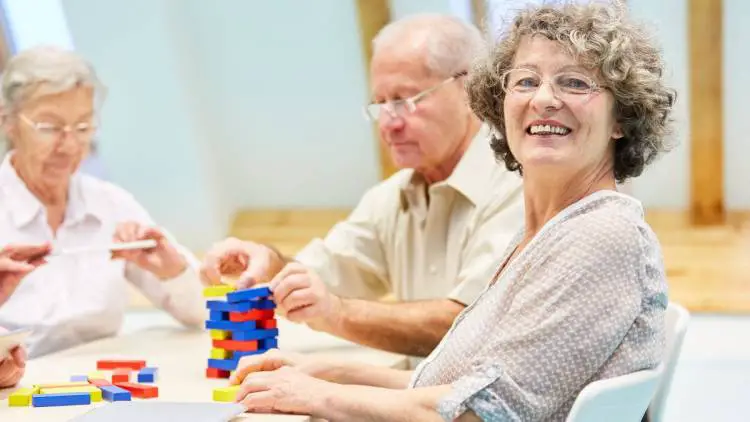seniors with dementia build a tower