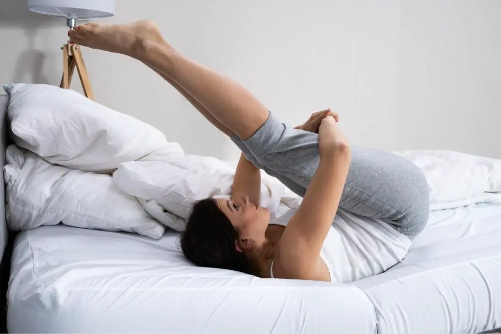 woman exercising in bed