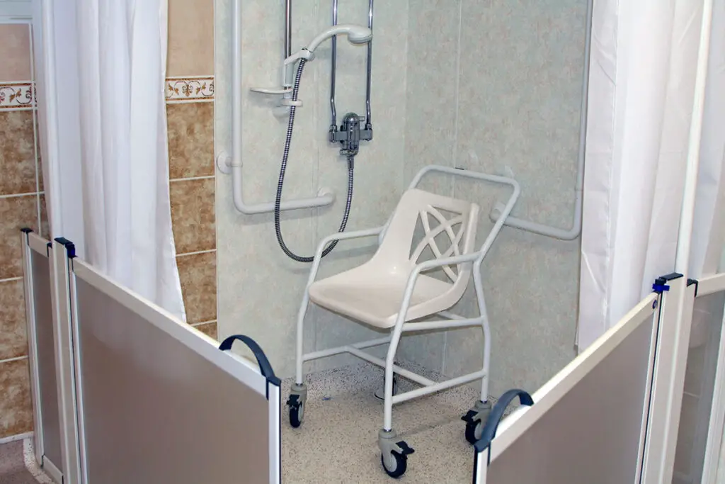 one of several shower chairs with arms