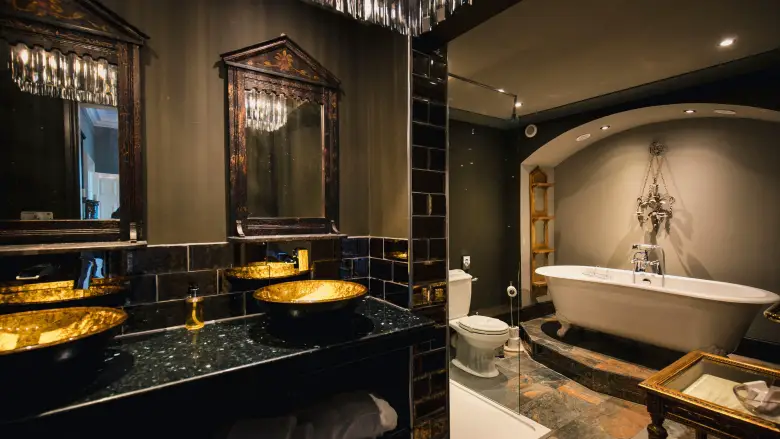 beautiful black and gold bathroom in a luxury hotel