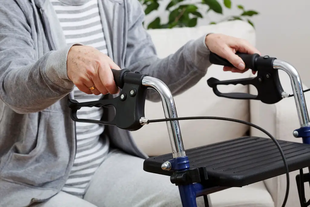 elderly woman with one of several walker trays