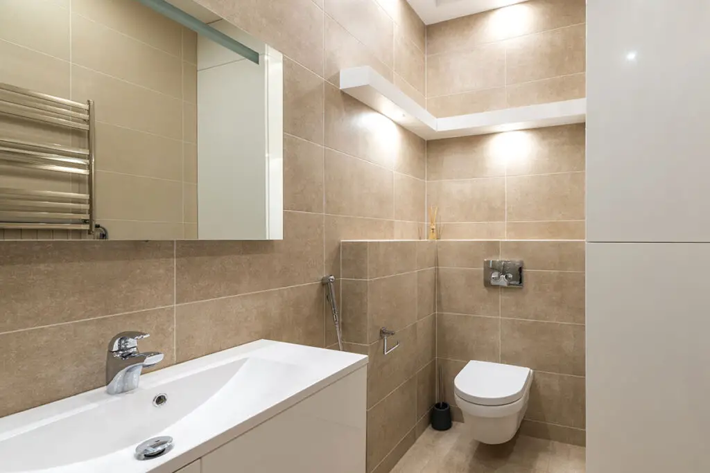 picture of bathroom in a hotel with overhead toilet lights
