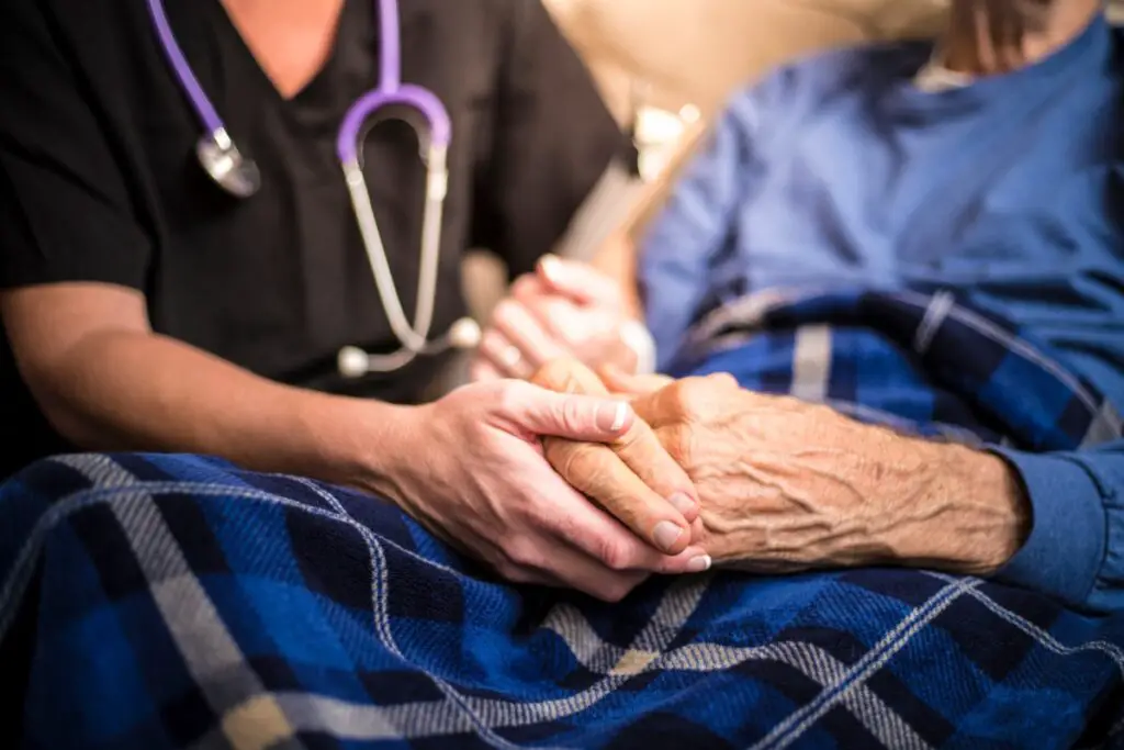 hospice nurse caring an elderly man
