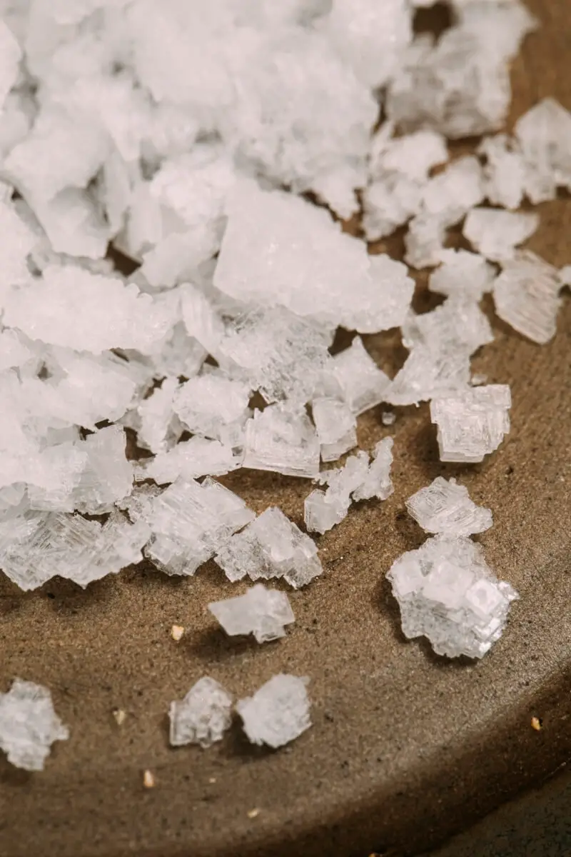 Salt crystals on a table. Does your mouth taste salty?