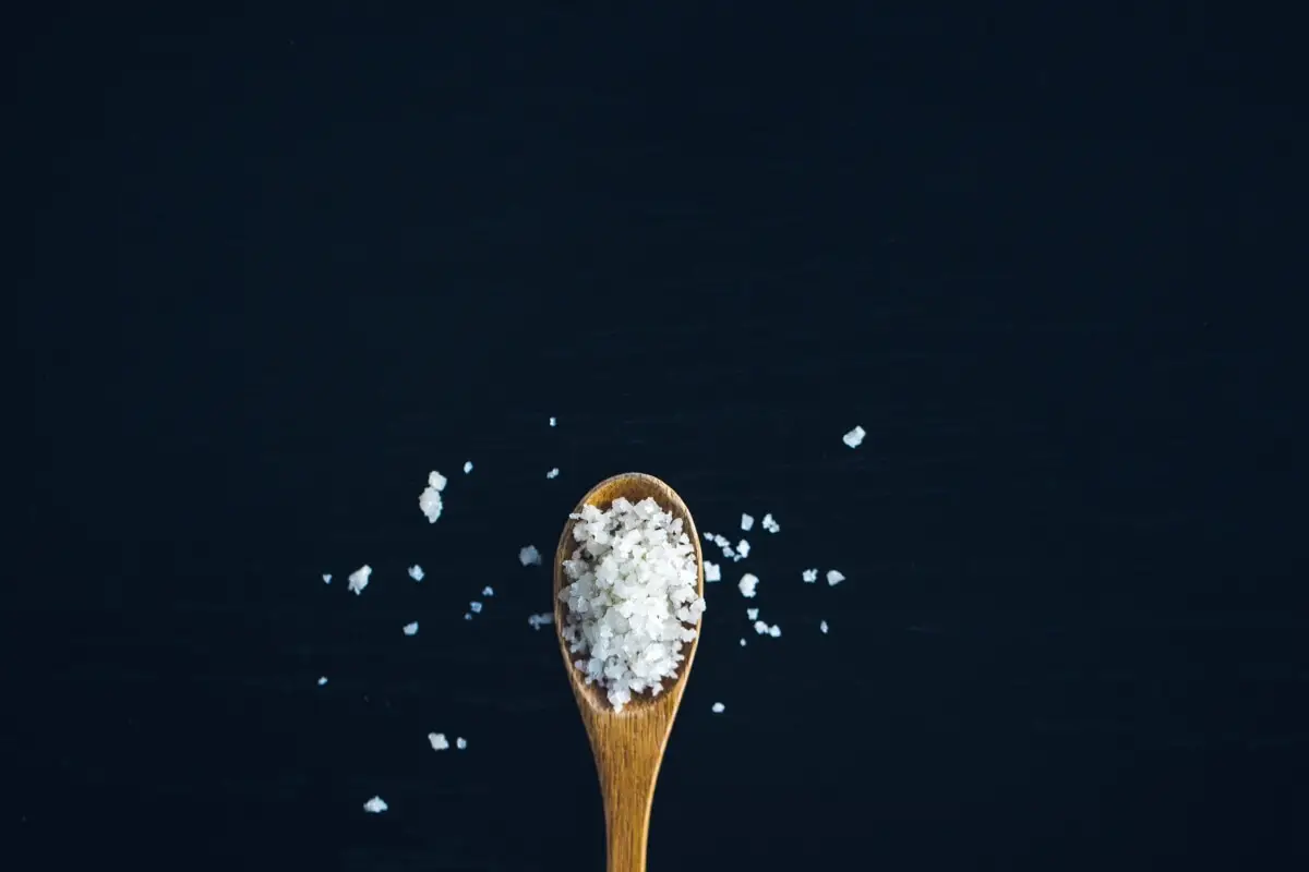 wooden spoon covered in salt