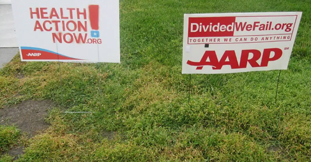Signs in yard outside of an AARP event