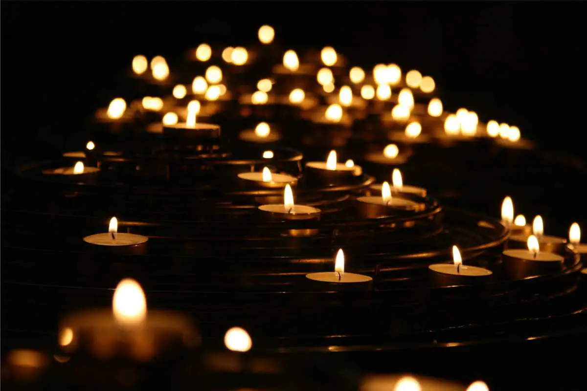 many lit candles as a way to honor those gone too soon - may they rest in peace and live on in our hearts forever