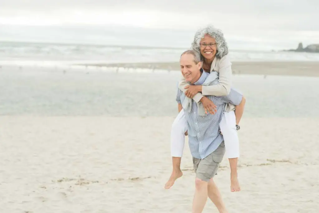 sexual health education article feature image of two older adults embracing on the beach