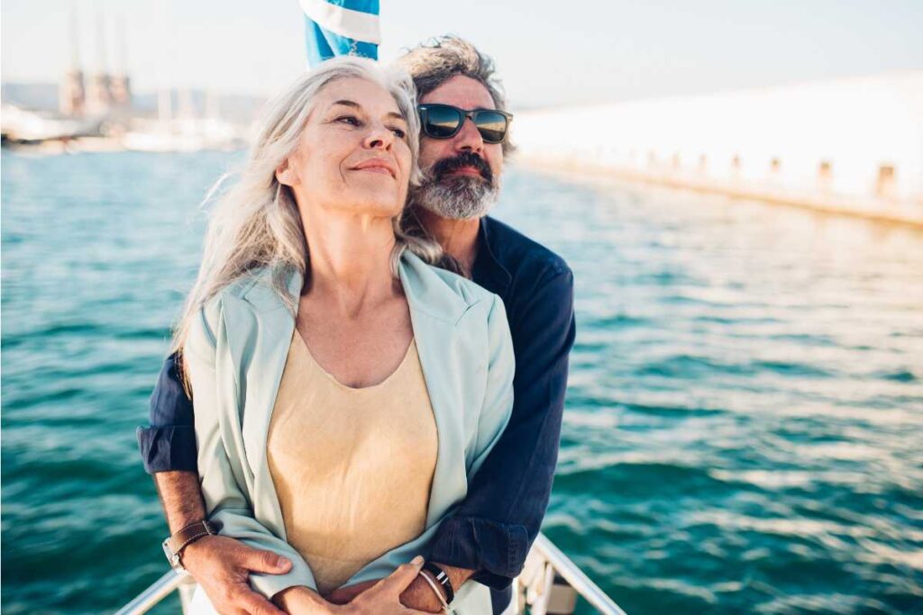 two adults of older age enjoying healthy relationships with each other while adventuring together on a boat