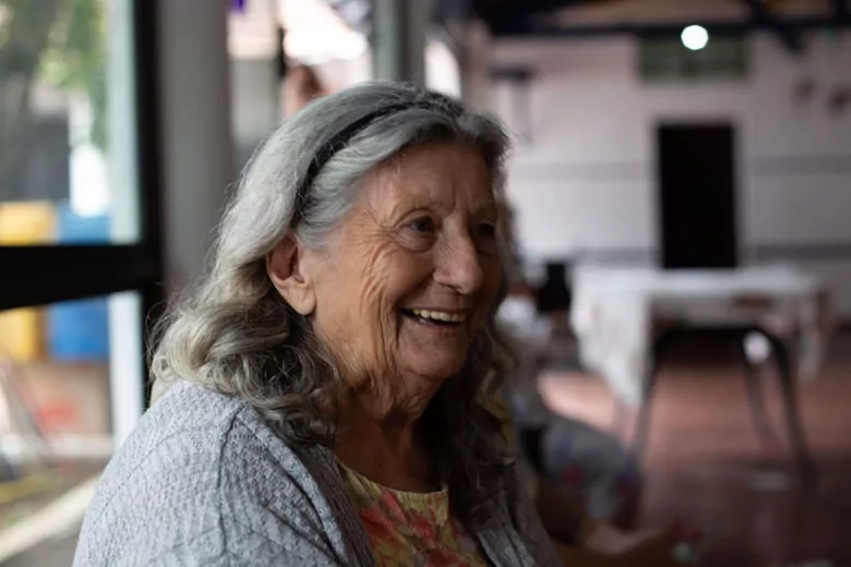 An image of a smiling older woman.